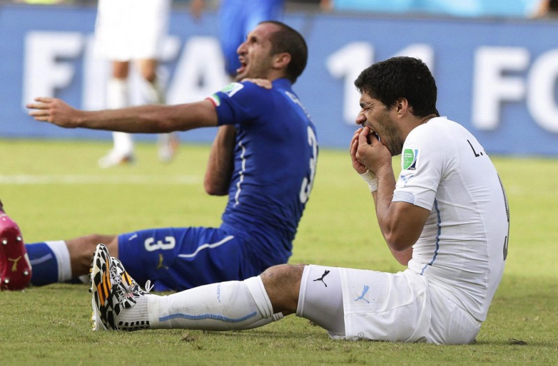 Suarez reaction after biting Chiellini, in Italy vs Uruguay, at the FIFA World Cup 2014