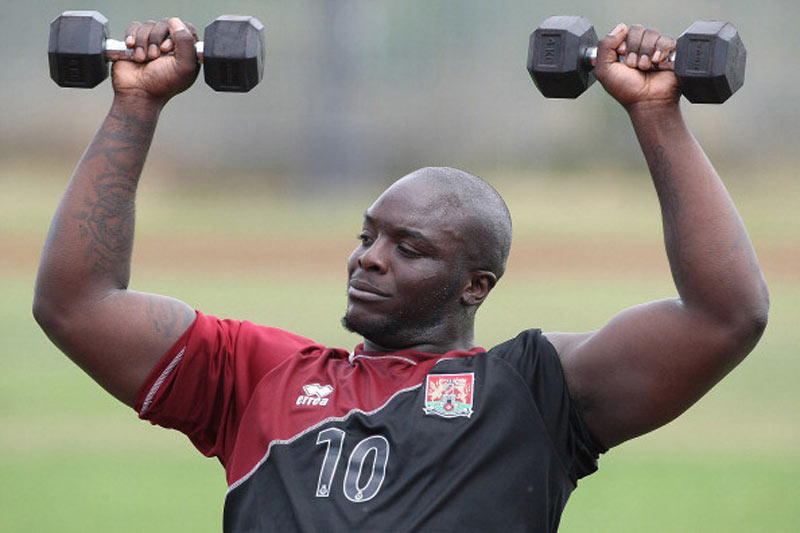 Adebayo Akinfenwa lifting weights in football