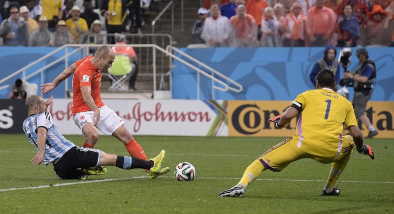 Javier Mascherano tackling Arjen Robben in the FIFA World Cup 2014 semi-finals, Argentina vs Netherlands