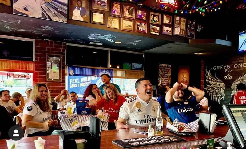 Football fans enjoying sports in a bar