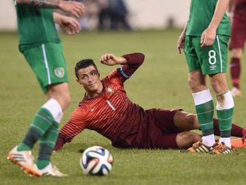 Cristiano Ronaldo laying down on the ground injured, in Portugal vs Ireland in 2014