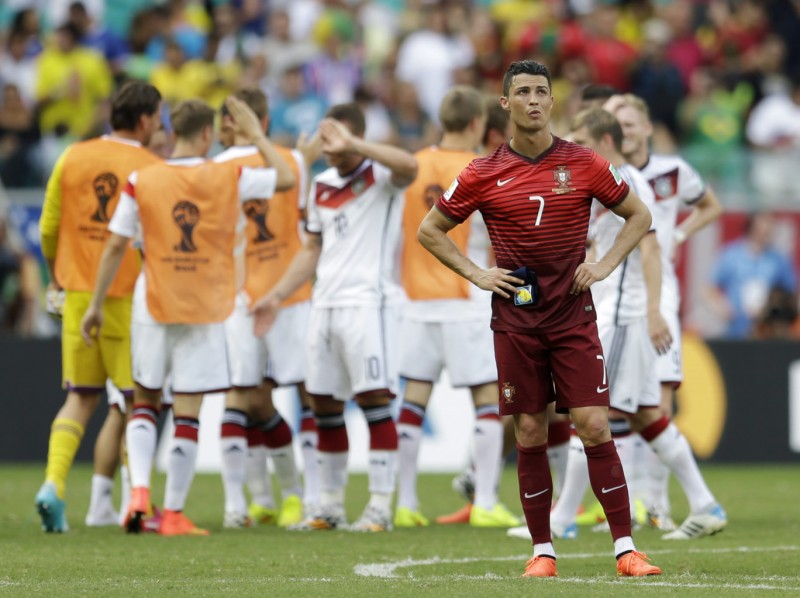Cristiano Ronaldo lonely moment with Germany celebrating just behind him, at the World Cup 2014