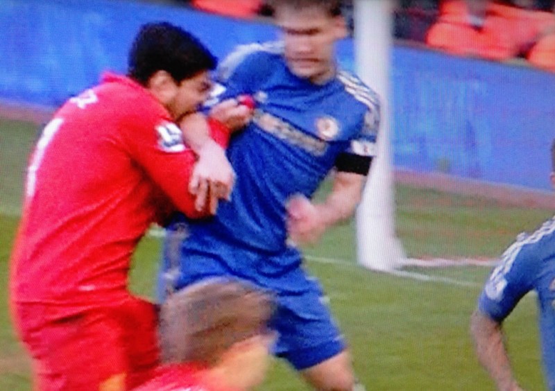 Luis Suárez bites Ivanovic, in Liverpool vs Chelsea in the EPL, in 2013