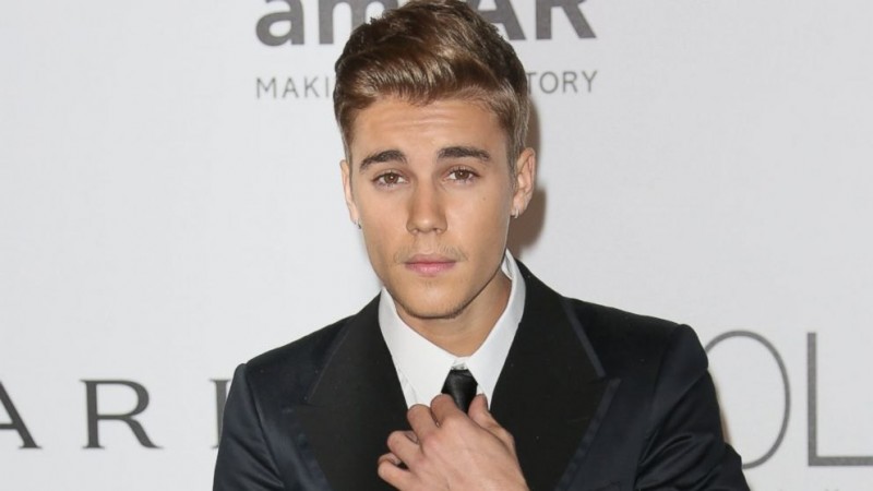 Justin Bieber wearing a suit and a tie