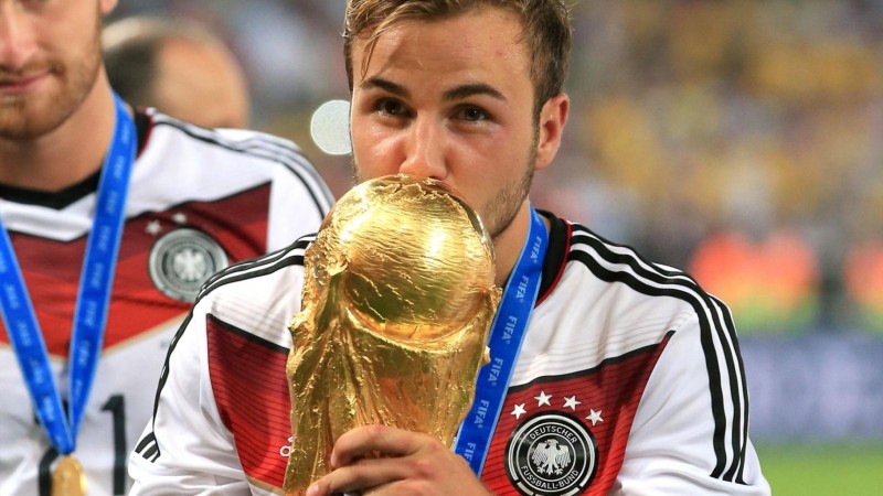 Mario Goetze kissing the FIFA World Cup trophy