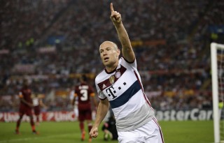 Arjen Robben celebrating Bayern Munich goal in a white shirt