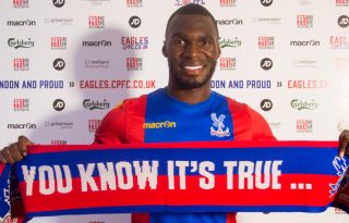 Crystal Palace's Benteke holding a you know it's true scarf