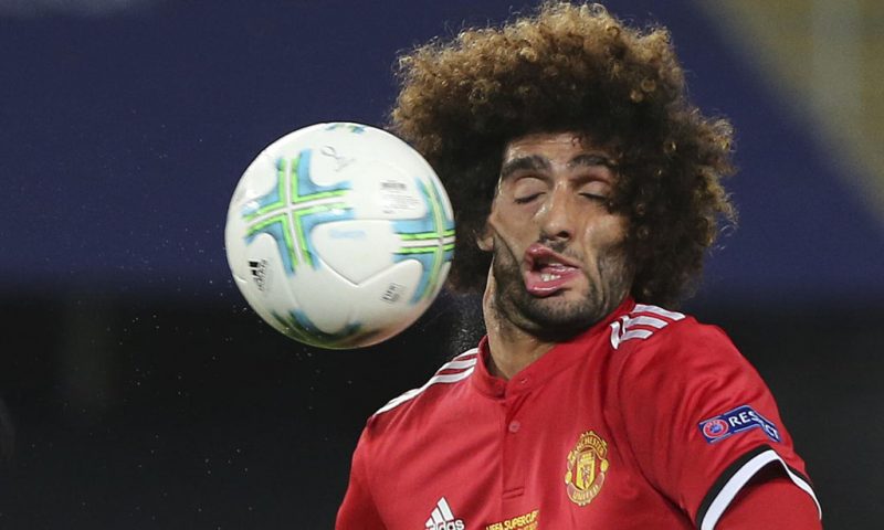 Fellaini ugly face after being hit by a ball